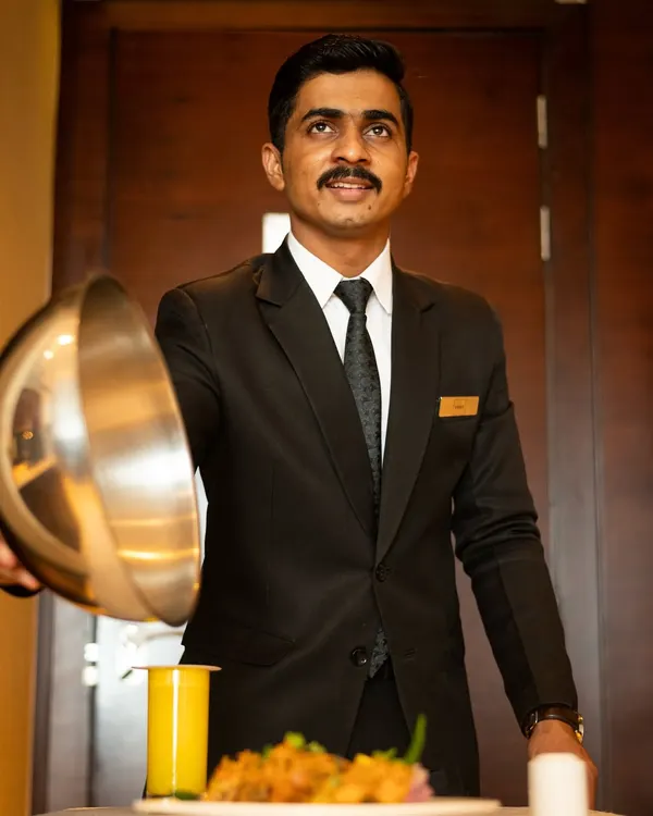 In-room dining served with a smile at the Courtyard by Marriott. This shot captures the essence of Indian hospitality, combining great food with warm service.