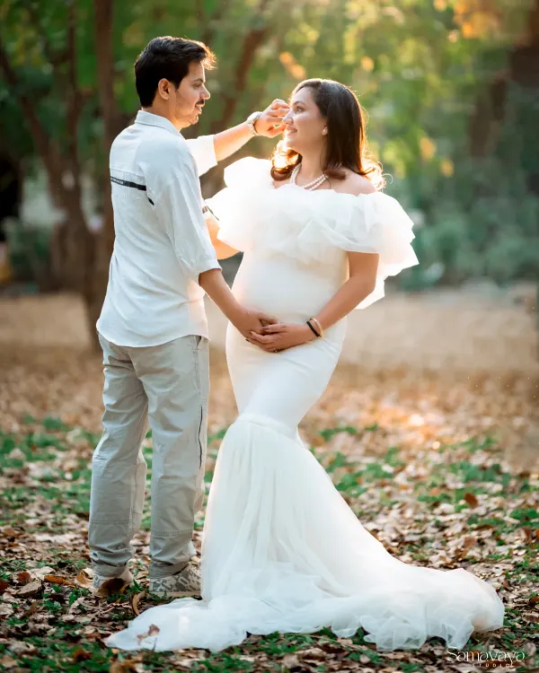 A quiet moment of connection between the soon-to-be parents, captured in the soft, warm light of a park. I love how nature provides the most beautiful backdrop for these candid pregnancy portraits.
