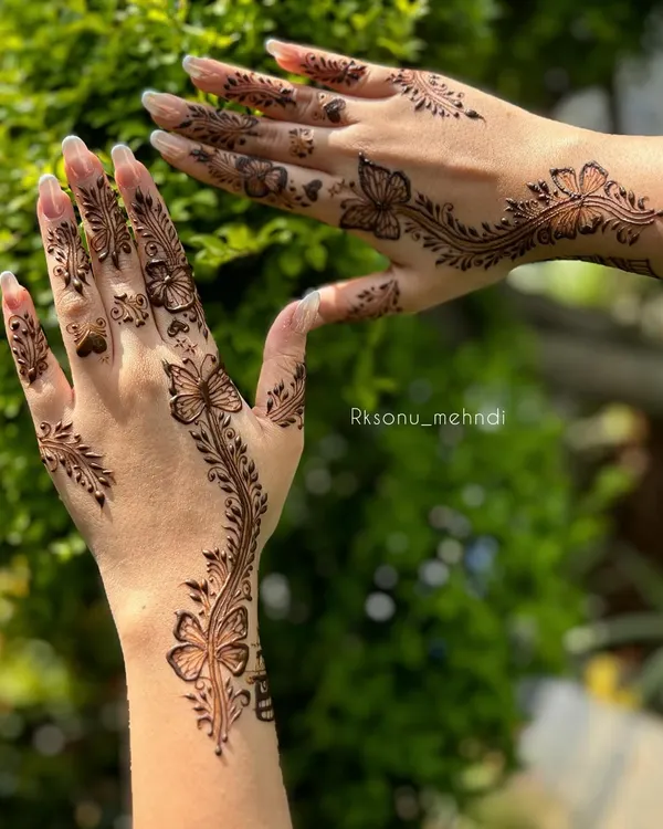 This bespoke butterfly design is a client favorite for its modern and whimsical feel. The delicate vines and scattered hearts add a touch of romance, perfect for an engagement or special party.