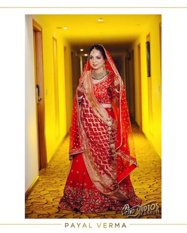This is the magic we create together. A bride glowing in her classic red lehenga, featuring a modern Dabka design intricately embodied with pearls and paired with a traditional Gharchola hand-embroidered dupatta.