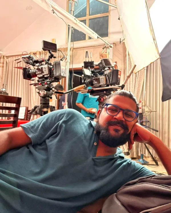 Taking a quick break on set. This behind-the-scenes shot shows the professional cinema cameras and lighting equipment we use for high-end video production.