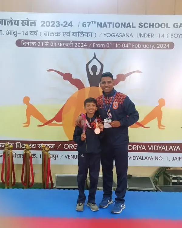 This is what we train for. We are incredibly proud of our student, Vidhish Raut, standing with coach Fayaz Jamadar after winning a medal at the 67th National School Games for Yogasana. This moment represents the dedication and hard work we instill in every athlete.
