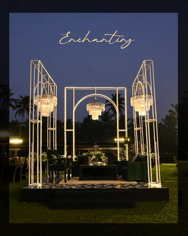 An enchanting Sangeet setup in Goa. We designed a modern, geometric stage with three magnificent chandeliers, creating a breathtaking focal point for the evening's performances.