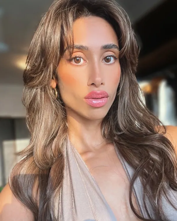 This client selfie says it all. She is radiating confidence with her new voluminous, layered hair extensions that give her a glamorous, photo-ready look anytime.