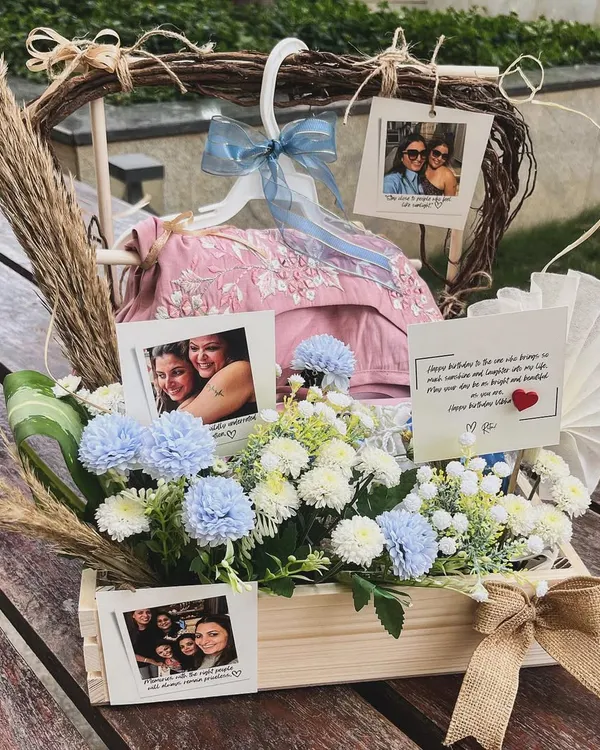 A chic hamper celebrating a special friendship for a birthday. I used a palette of white and powder blue florals to complement the beautiful outfits gifted inside, adding personal photos to truly capture their bond.