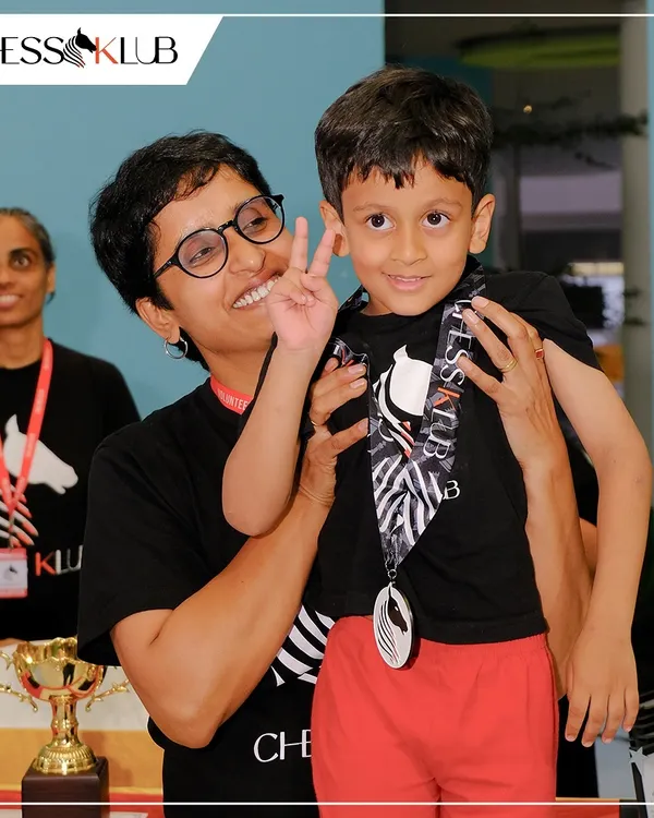 We believe in celebrating every player. Here, one of our budding champions receives a medal at the Chess Carnival 2024, a moment of pure joy that captures the spirit of our supportive community.