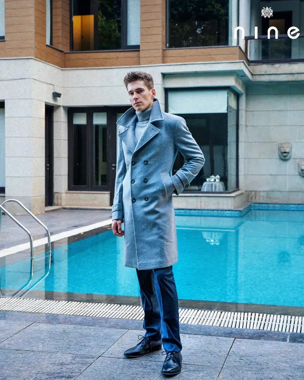 Our double-breasted overcoat in a beautiful grey wool and cashmere blend. Paired with a polo neck and straight-fitted trousers, this is the perfect look for winter.