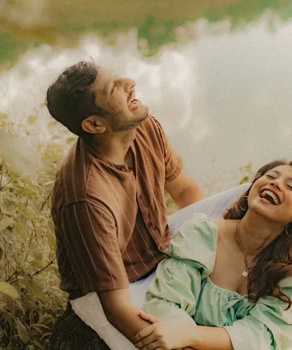 A moment of pure, unscripted laughter by the lake. For us, a pre-wedding shoot in nature is about capturing the joy and freedom you feel when you're together in the wild.