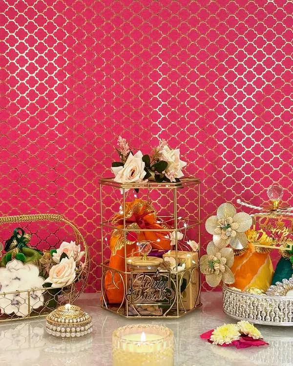 A beautiful snapshot of my Diwali collection, featuring a gold wire basket, a regal cage hamper, and a crystal-accented silver tray. Each piece is designed to bring a unique sparkle to your festive gifting.