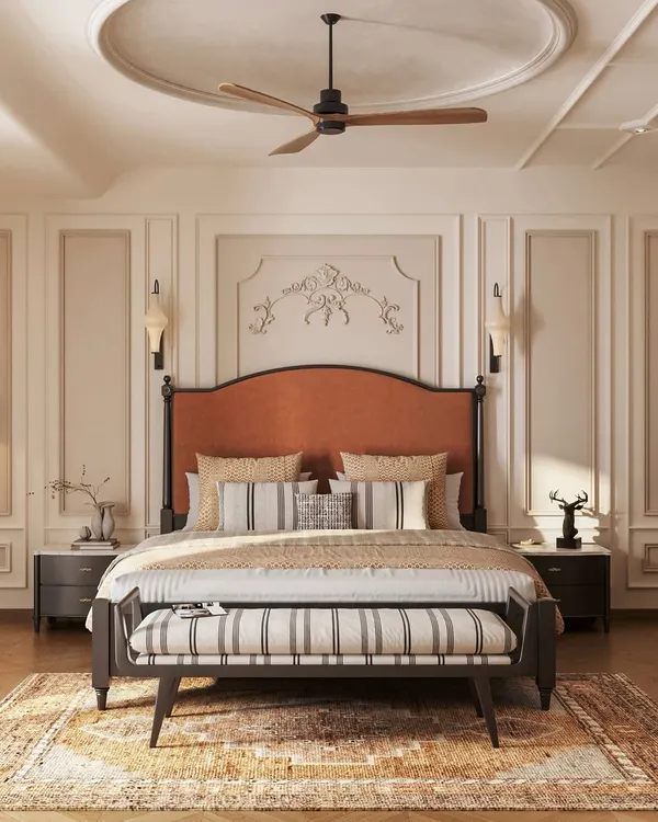 This master bedroom is a study in neoclassical elegance. We used classic wall moldings, a timeless two-poster bed with a rich rust-orange headboard, and a balanced, neutral palette to create a sanctuary that feels both grand and deeply restful.