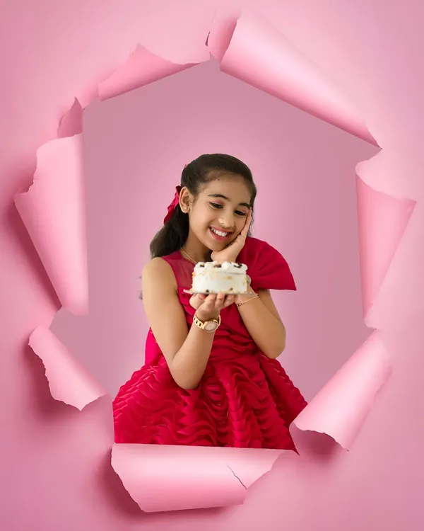 A creative and fun birthday portrait for an older child. This unique paper-tear effect adds a pop of color and personality, making her birthday photos truly one of a kind.