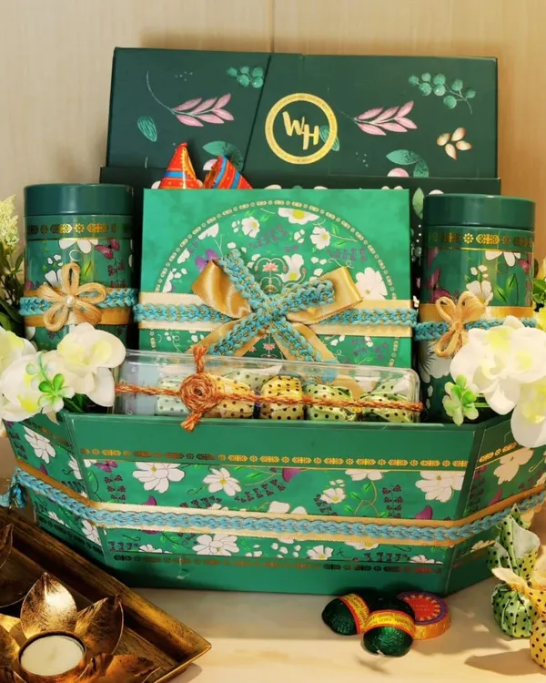 This is what a celebration looks like. I designed this opulent festive hamper with a lush green floral theme, packing it with premium treats and handcrafted details to create a truly unforgettable Diwali gift.