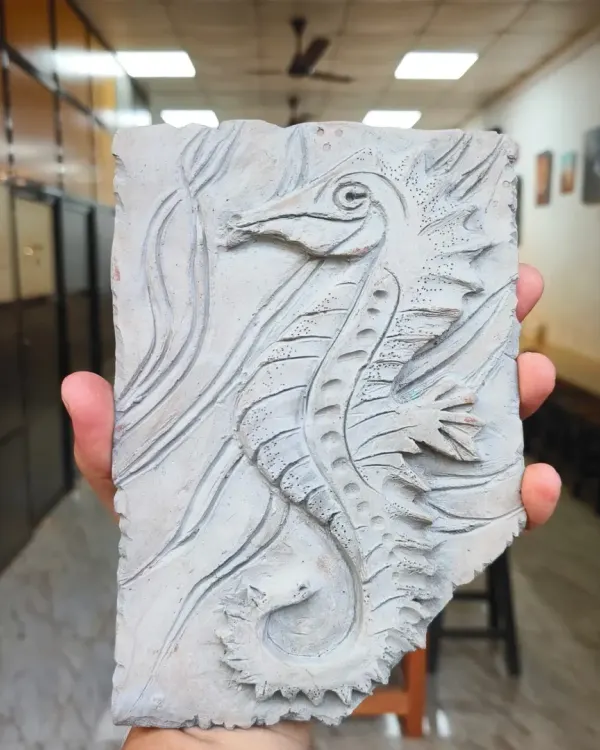 This incredible seahorse fossil mural, created by one of our students, looks like an artifact dug from the earth. The class focused on creating deep textures and intricate details to achieve a realistic, time-worn effect.