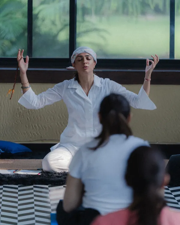Guiding a class at the Premaha Wellness workshop. In these moments, we choose stillness together, creating a collective energy that allows everyone to come home to themselves.