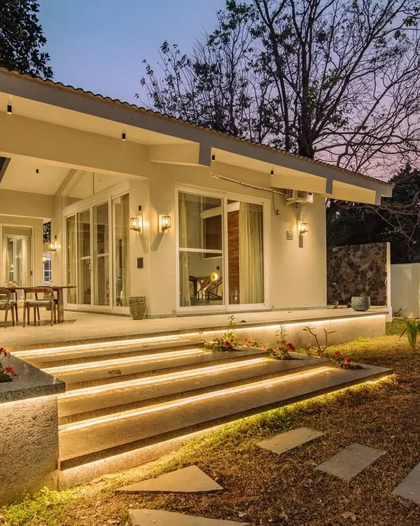 This is where the magic happens after sunset. For the Amberle farmhouse, I designed a custom lighting scheme with subtle LEDs under the steps to create an inviting glow, transforming the garden into an enchanting space that beckons you outdoors.