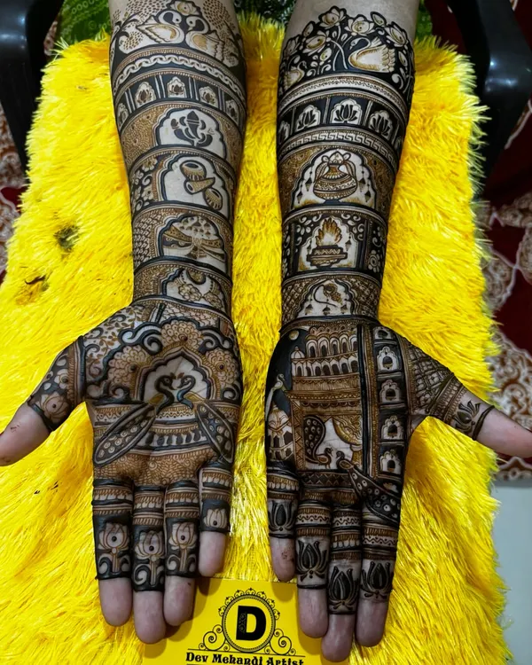 This is a classic full bridal mehndi design created by my team. It features traditional Indian motifs, including palace windows (jharokhas), floral patterns, and paisleys, for a timeless look.