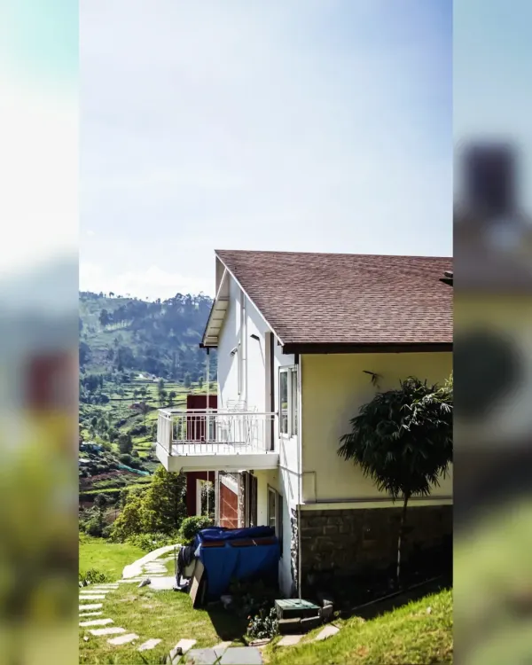 A view of the Raghunath Farmhouse, showing how the split-level design follows the natural slope of the hill. This approach allowed us to minimize excavation and create a home that blends quietly into its surroundings.