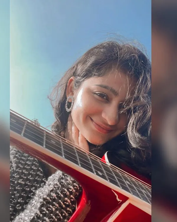 A happy selfie with my guitar. This instrument is like an extension of me, and I take it everywhere.