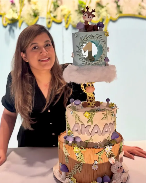 So proud of how this whimsical forest cake turned out. It combines structural work with detailed fondant characters like the giraffe and deer.