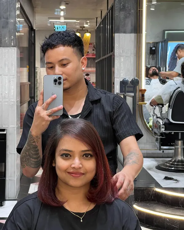 Everything feels better after a fresh hair color and cut. This client is rocking her new chic bob with a subtle reddish tint.