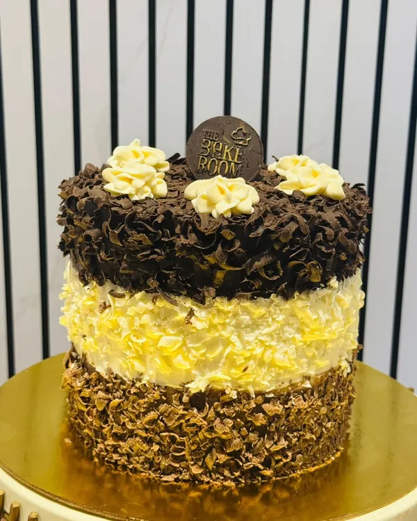 My signature Triple Chocolate 24 Heaven Pastry. This cake has 24 layers of dark, milk, and white chocolate sponge and mousse, creating a truly heavenly experience for chocolate lovers.