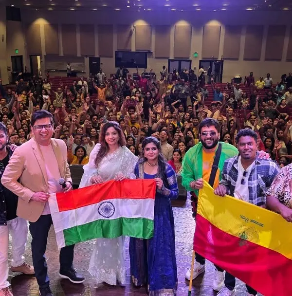 A proud moment with my band and the Indian and Kannada flags after a successful show in America. It is an honor to represent our culture on a global stage.