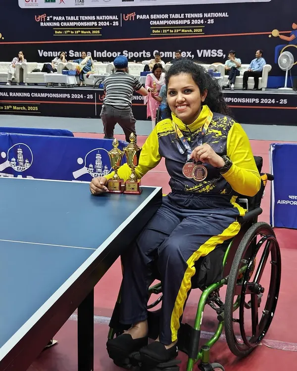 We train champions. Here is our paddler, Rajlakshmi S J, celebrating her victories at the Para National Championships, showcasing her trophies and medals earned through dedicated wheelchair table tennis training.