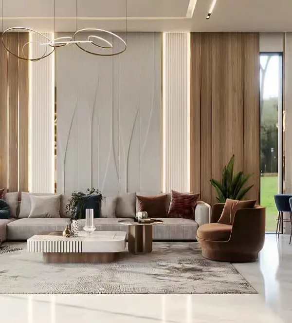 A luxurious and spacious living room featuring a large sectional sofa, elegant wood and textured wall panels, and sophisticated lighting. The open layout connects seamlessly to a bar area, making it ideal for hosting guests.