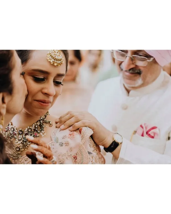 A daughter's tears and a father's comfort. This incredibly tender moment between the bride and her parents is a powerful reminder of the love that shapes us.