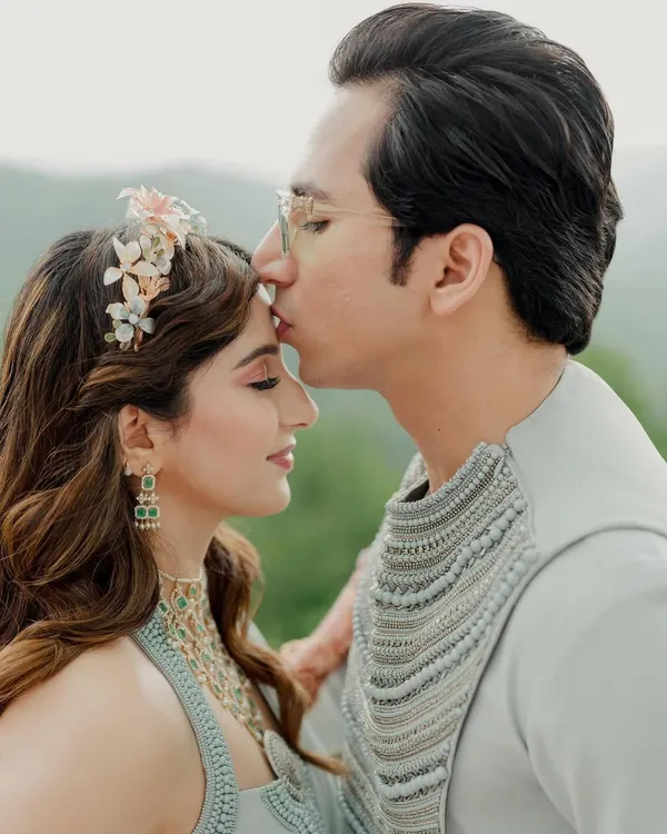 A tender kiss on the forehead against a stunning mountain backdrop. I find the most scenic spots at your destination for these timeless, romantic portraits.