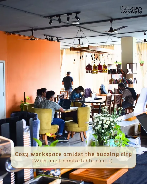 This is the heart of my cafe, a cozy workspace buzzing with quiet energy. With comfortable chairs and a warm, inviting atmosphere, it’s the perfect place to settle in and get things done.