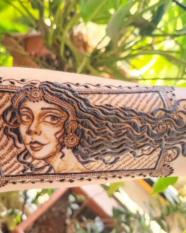 A close-up of a portrait I doodled on my arm. I love practicing new faces and hair textures, letting my creativity flow to create unique characters with henna.