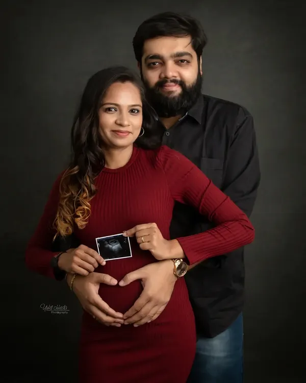 The very first picture. Holding up your sonogram is a simple yet powerful way to announce your pregnancy. This is the beginning of a beautiful new chapter.