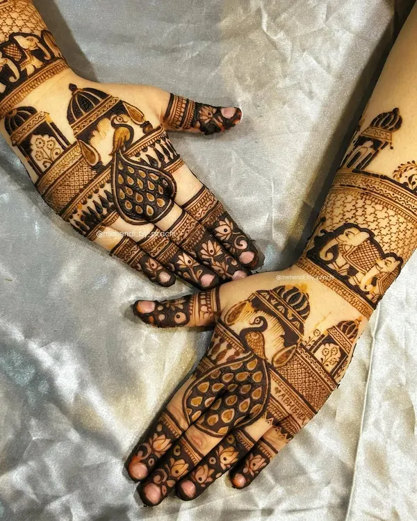 A classic bridal design featuring symmetrical peacocks and palace domes. This style is timeless and brings a sense of royal elegance to the hands.
