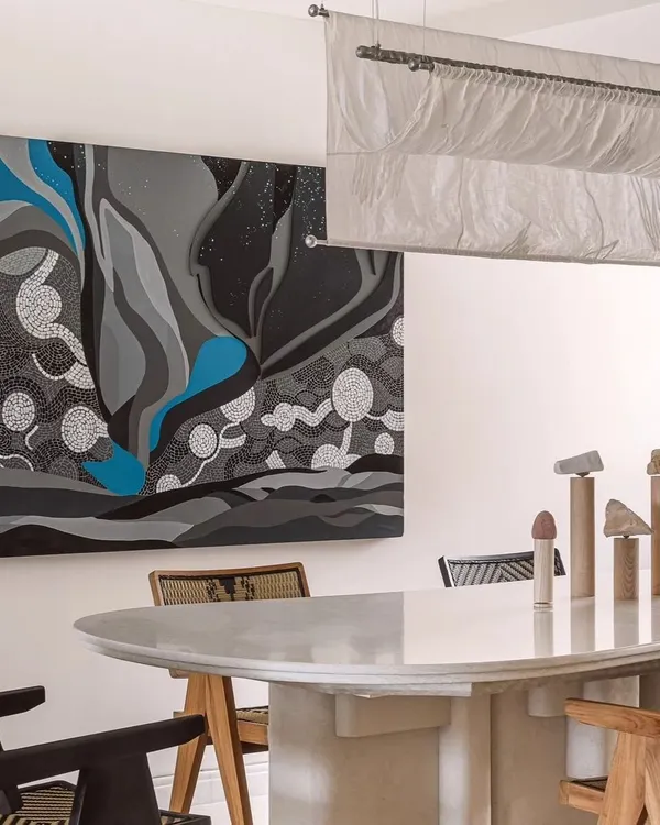The 'Cognizance' canvas painting, shown here in a minimalist dining room setting. This large abstract piece was inspired by stargazing on a dive trip, capturing the feeling of being a small part of a vast, immeasurable universe.