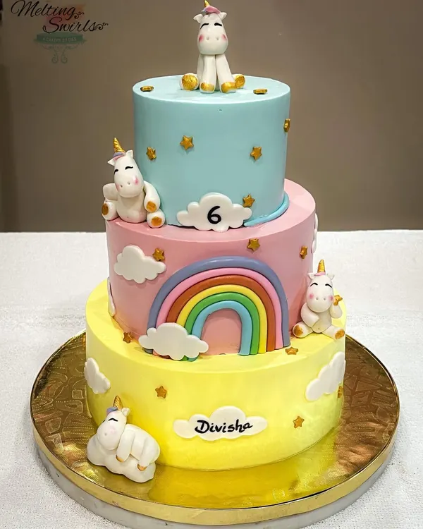Our first three-tier whipped cream cake was a special project for a sixth birthday. The pastel-colored tiers are decorated with handmade fondant unicorns and a rainbow, creating a truly impressive centerpiece.