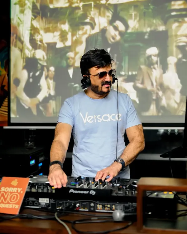 I’m a Video DJ, which means I don't just play the music, I bring it to life. Here I am mixing a classic track while the original music video plays on the big screen, creating a full Chitrahaar experience for your event.