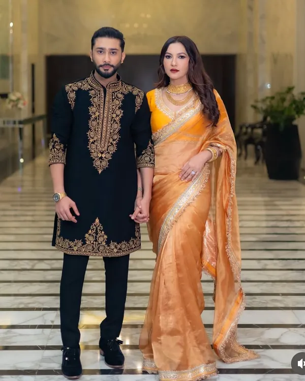 This is the kind of timeless look we create for your biggest moments. Here’s the wonderful couple Zaid Darbar and Gauahar Khan, with Zaid wearing a custom black sherwani featuring intricate gold embroidery, designed to make a statement of pure class.