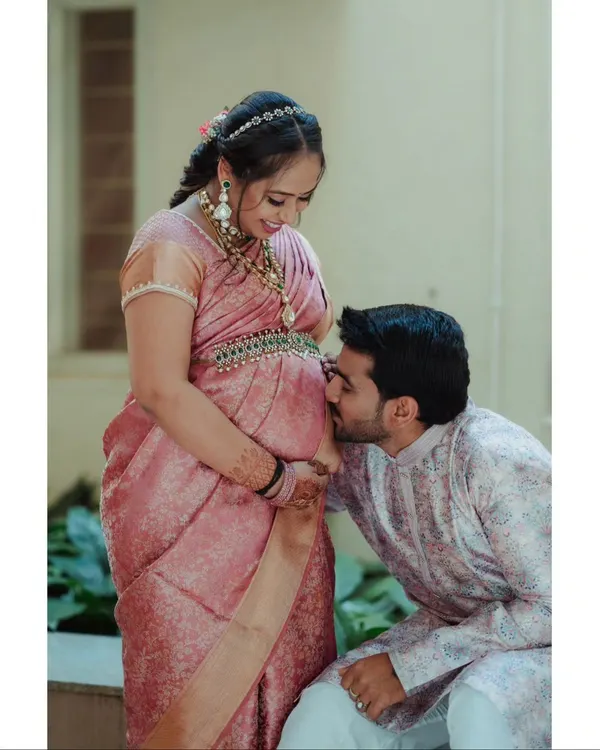 A quiet moment of connection before the arrival of your little one. I love capturing this pure anticipation and love. This outdoor maternity session focused on the couple's bond, using soft natural light to highlight the beautiful baby bump and their traditional attire.