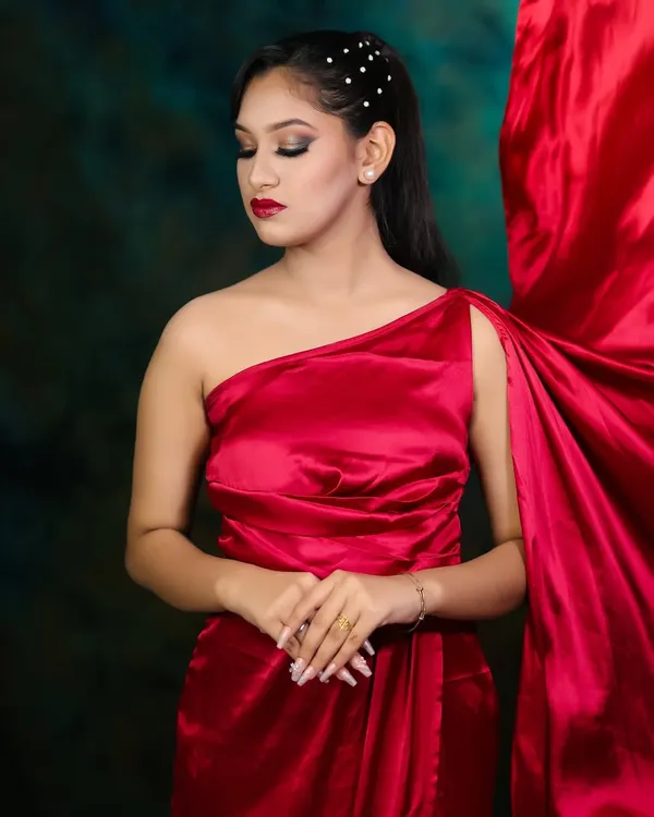 A timeless glamour look with a flowing red satin dress. Our students learn to create elegant and sophisticated styles for any high-class event.
