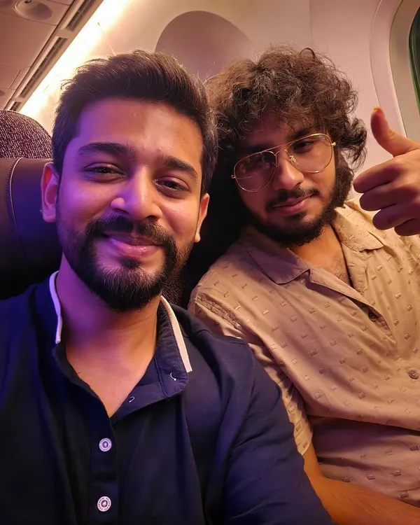 On a flight for my UK tour with fellow musician Abhed Abhisheki. Traveling for concerts is a journey of music and friendship.