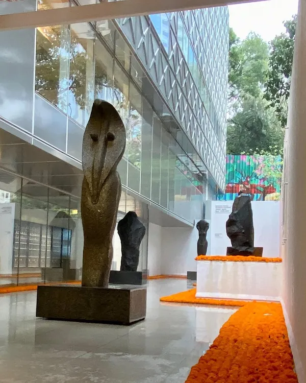 The entrance gallery at the Museum of Art & Photography (MAP) in Bangalore, featuring sculptures by Stephen Cox. The space is designed as a transitional zone, preparing the visitor for the experience within and showcasing the powerful dialogue between art and architecture.