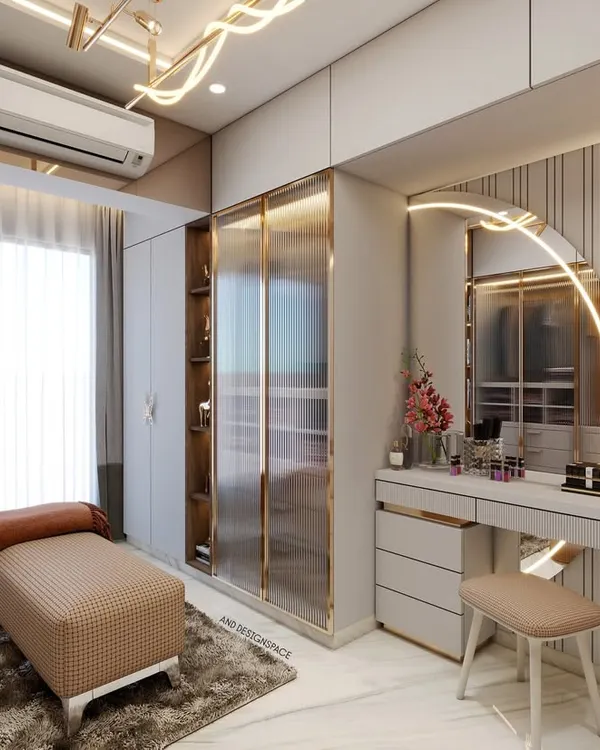 A 3D render of a bedroom that includes a walk-in wardrobe and a dedicated vanity area. The design features a backlit arched mirror, fluted wall panels, and consistent use of gold accents for a luxurious feel.