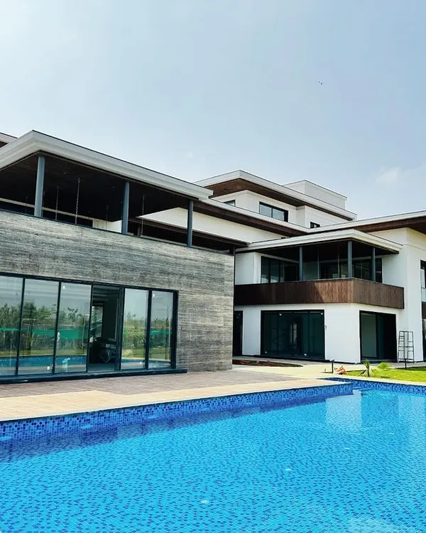 A wide view of a recently completed swimming pool for a modern residence. Our construction process ensures seamless integration with the property's architecture, creating a clean, expansive outdoor oasis perfect for relaxation and entertainment.