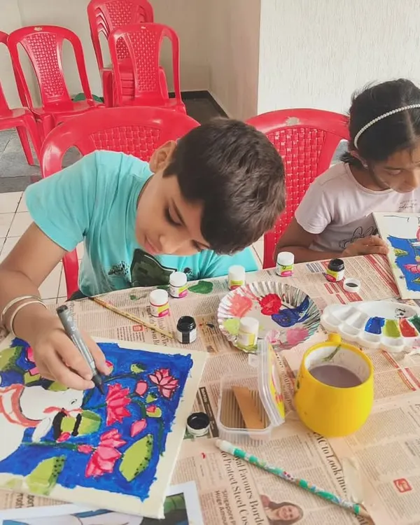 Young artists focused on their Pichwai paintings during a workshop. We provide all the materials and guidance to help children explore traditional art forms in a fun, supportive setting.