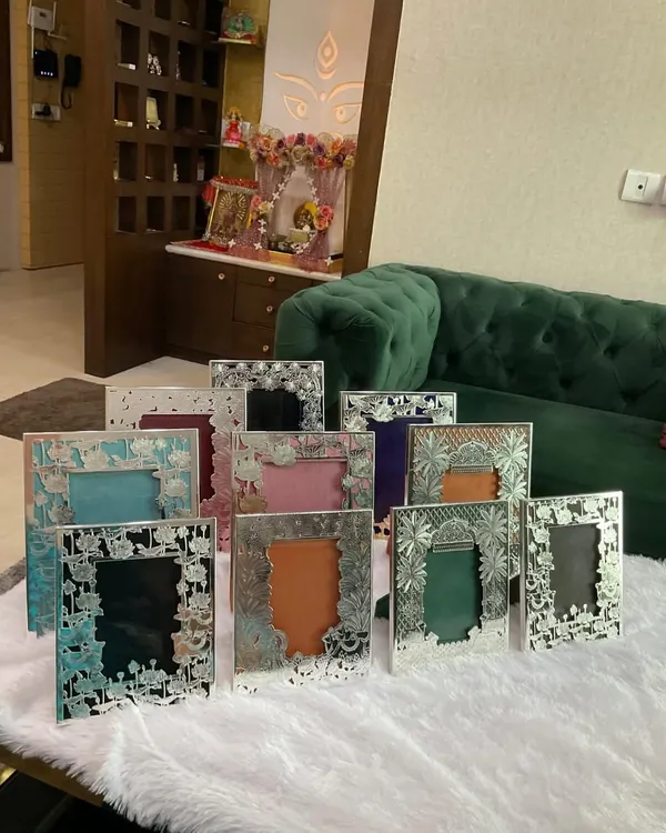 My silver photo frames are designed to turn your memories into heirlooms. Here is a collection of various designs, from floral cutouts to traditional motifs, each ready to hold your most cherished moments.
