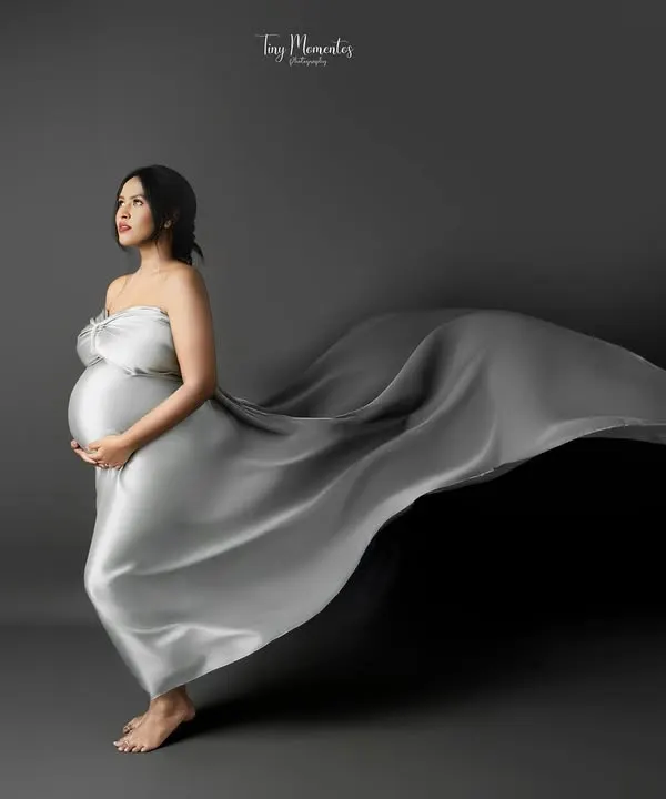 This is the art of waiting. I use flowing fabrics and gentle posing to create fine art maternity portraits that feel both powerful and serene, capturing the goddess within you.
