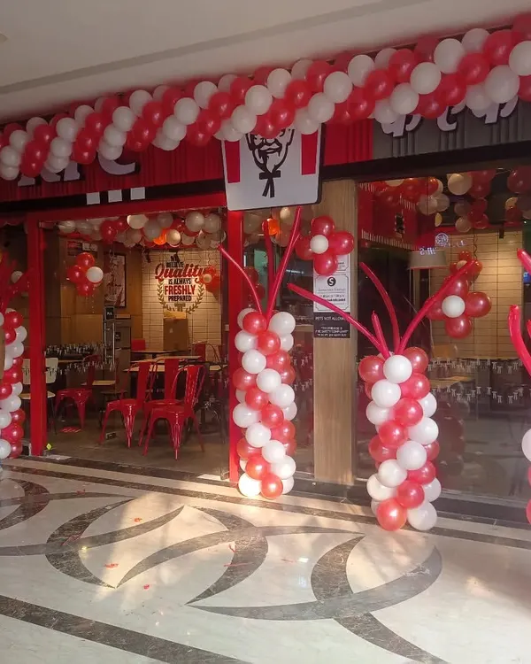 I handle commercial events and shop openings too. Here is the balloon decoration I did for a new KFC outlet, designed to match their brand colors and create an exciting atmosphere for the launch.