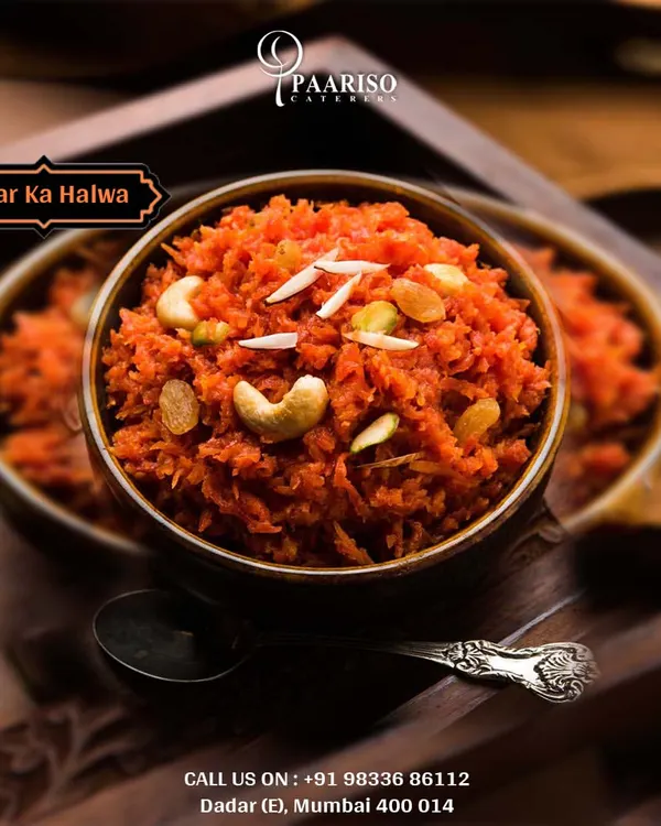 A comforting bowl of our homemade Gajar Ka Halwa. This traditional Indian dessert is made by slow-cooking grated carrots with milk, ghee, and sugar, garnished with cashews and raisins for a rich, aromatic treat.