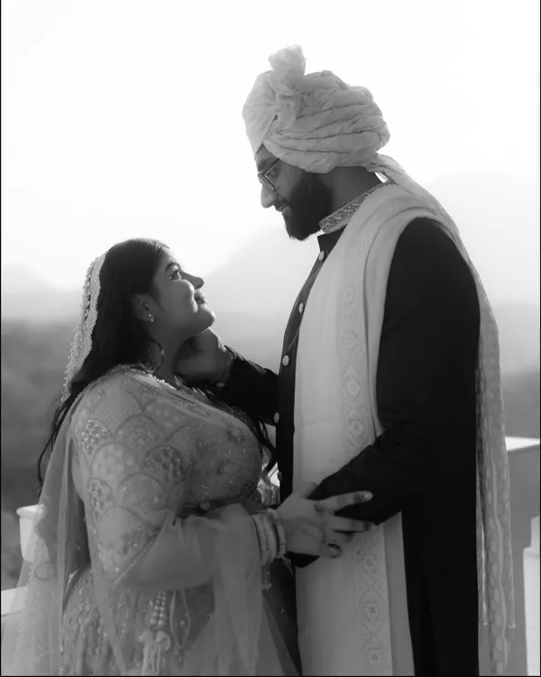 An intimate black and white portrait of Rhea and Sai. The soft light and their gentle expressions create a timeless and romantic image that focuses purely on their connection.
